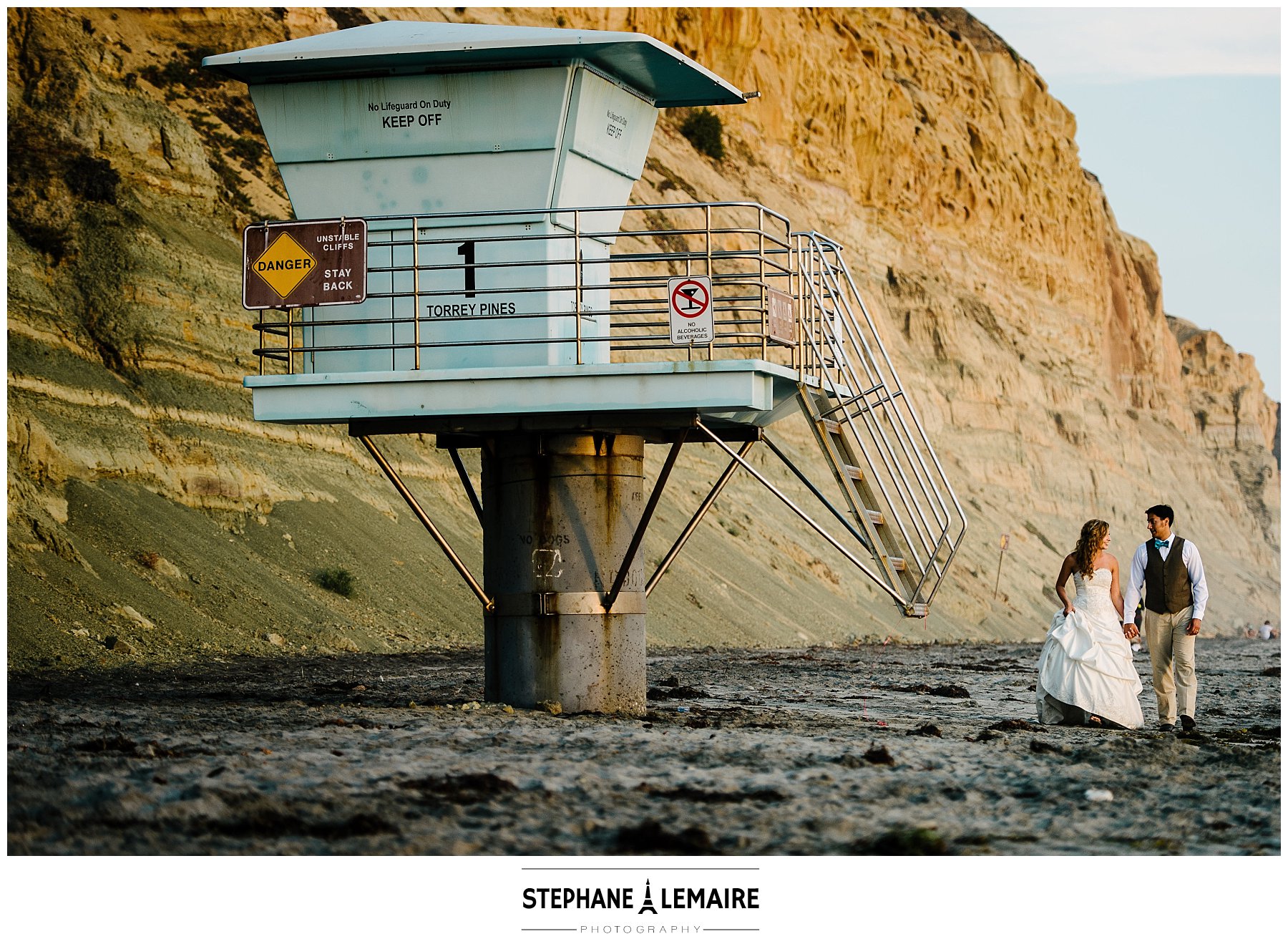 San Diego Wedding Session- Scenery shot of couple on the beach near lifeguard station at Torrey Pines State Natural Reserve
