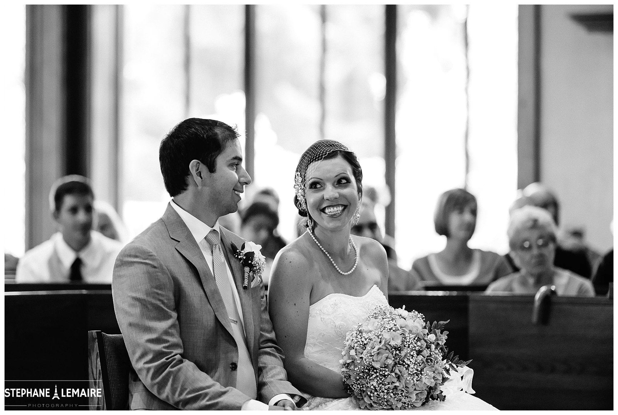 Bride and Groom smiling at each other during ceremony