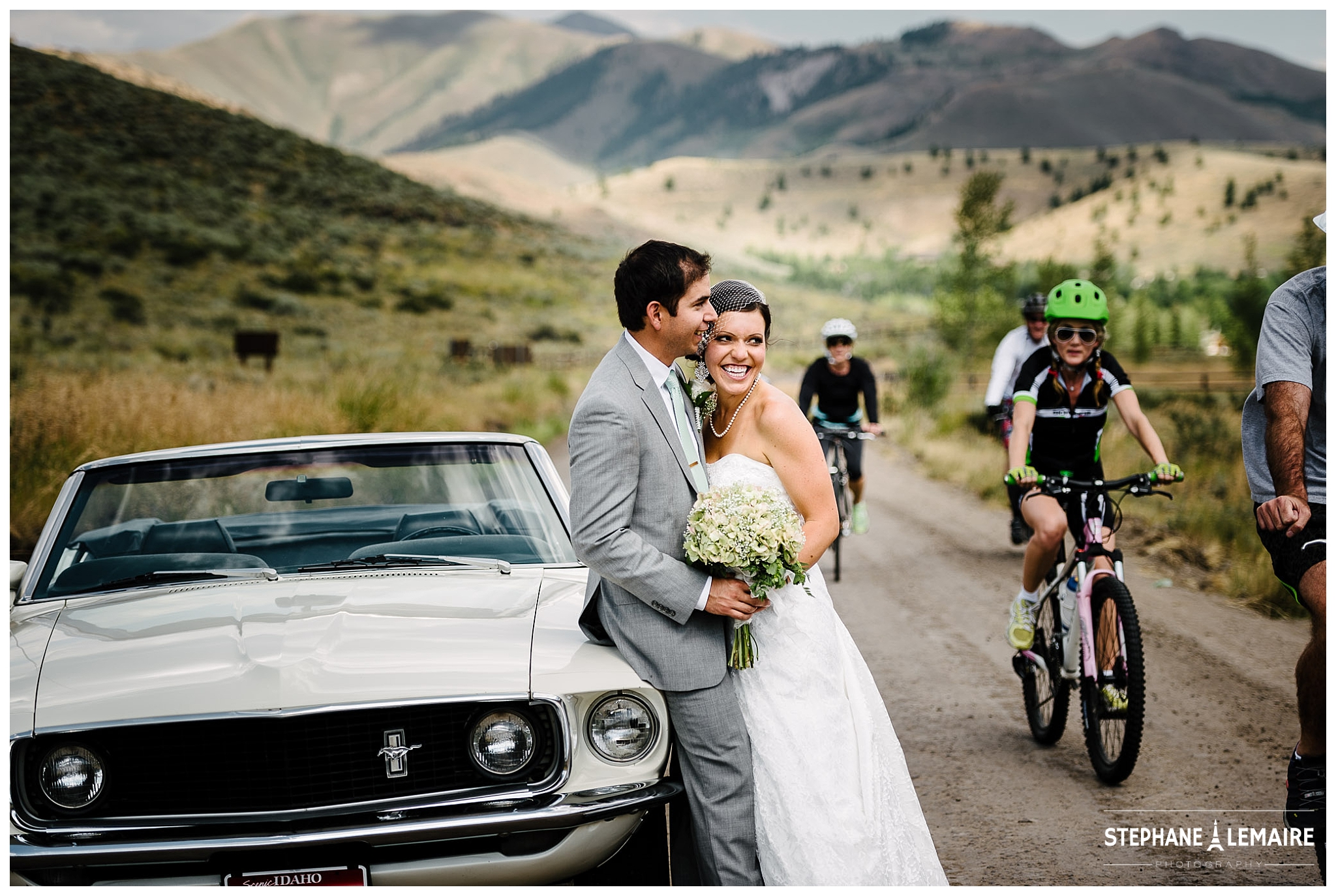 Bride and Groom laughing while being interrupted by bikers