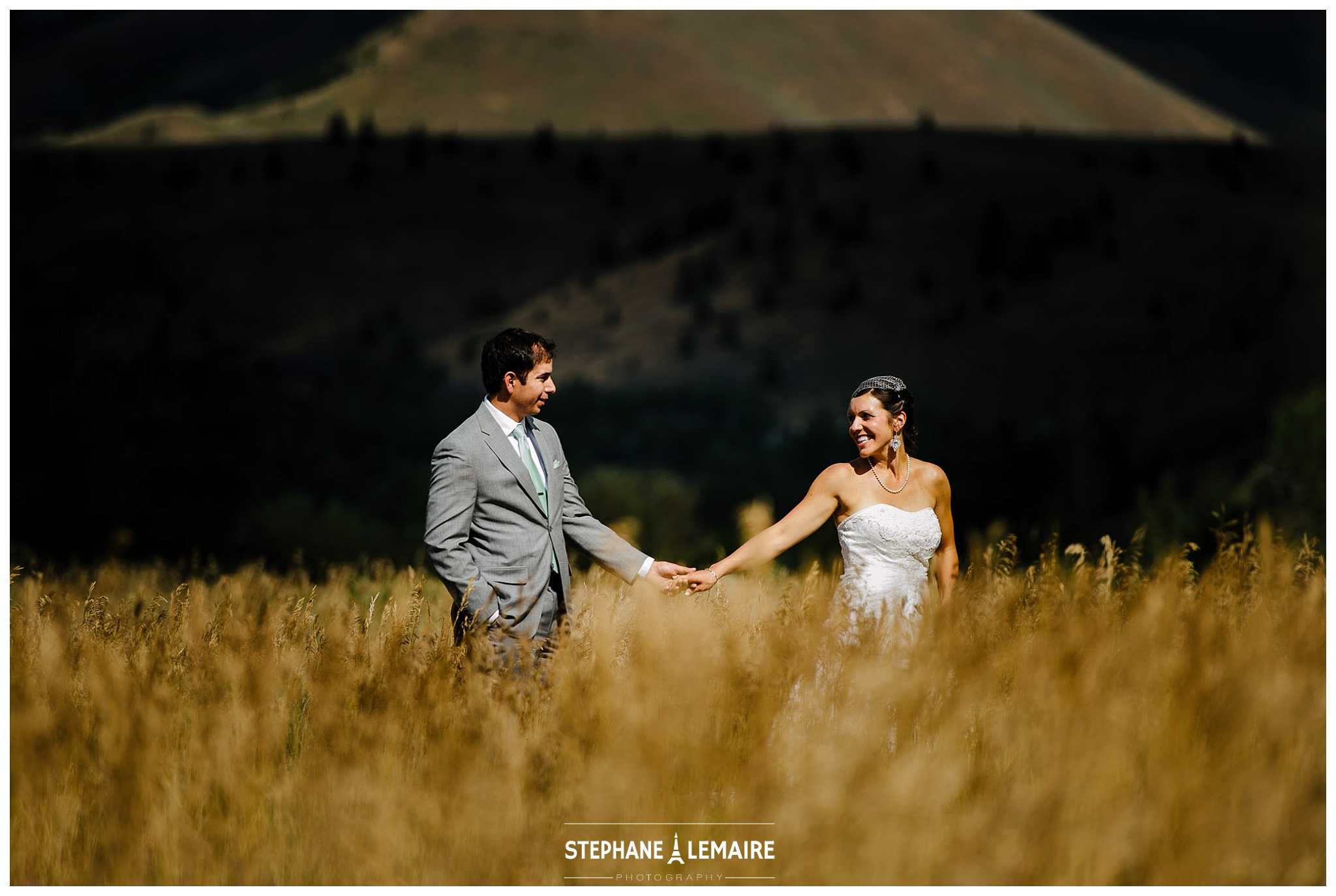 Bride and Groom in field at Sun Valley Wedding