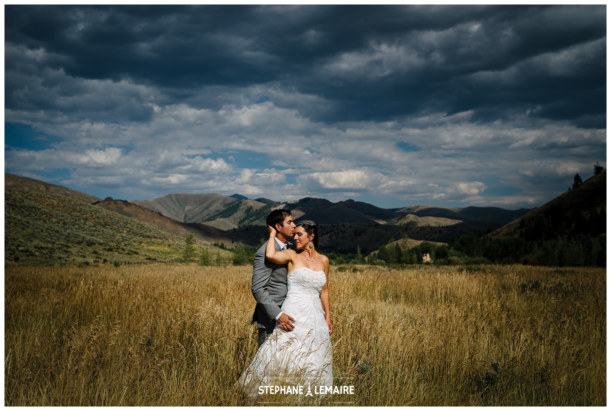 Landscape Portrait  of Bride and Groom holding one another for their Idaho wedding