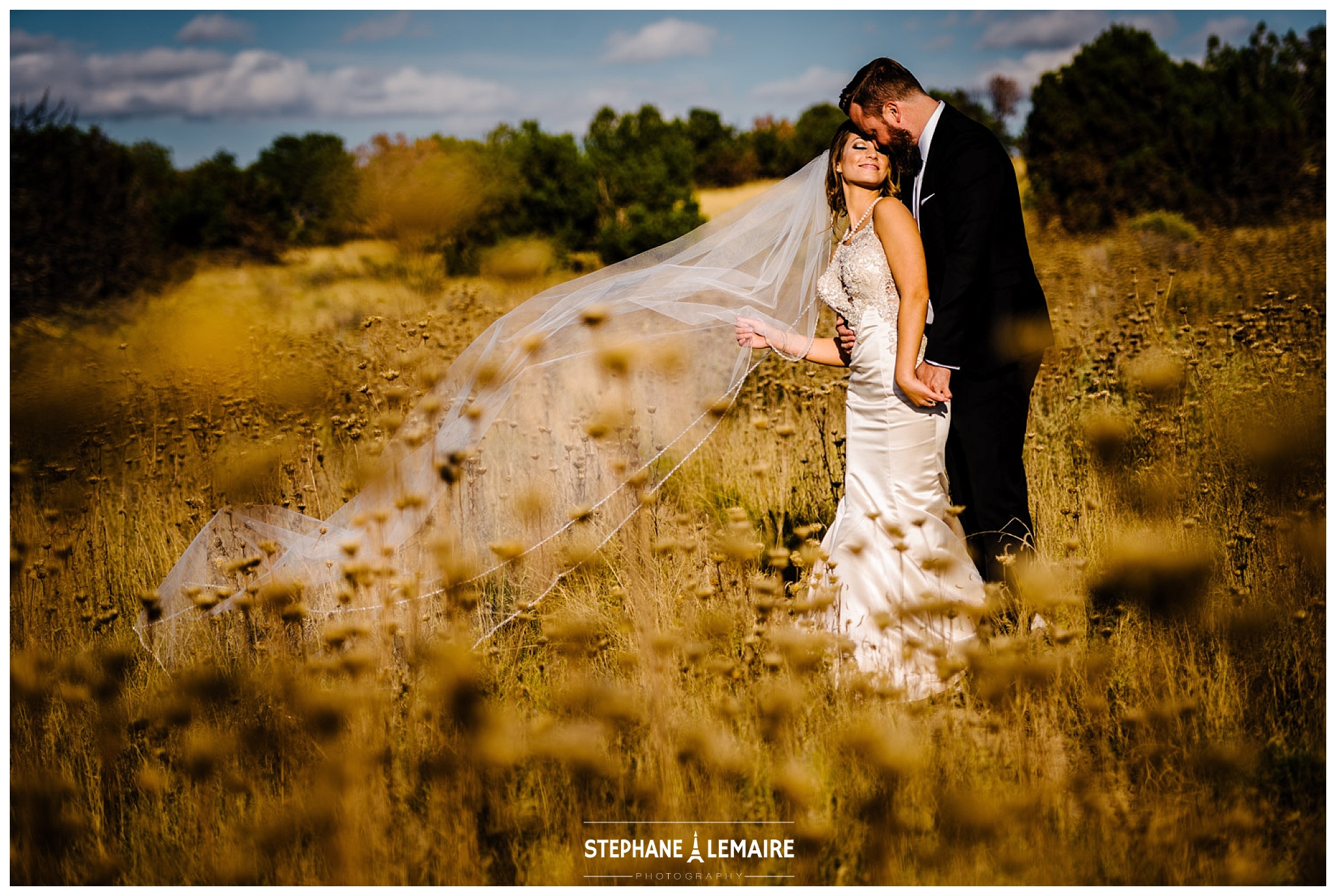  Bride and Groom in field at Spencer theater wedding in Ruidoso by Stephane Lemaire Photography 