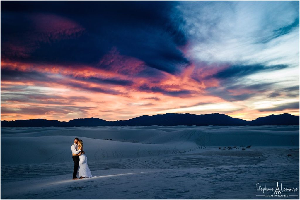 Bride and groom enjoying sunset at White Sand National monument New Mexico
