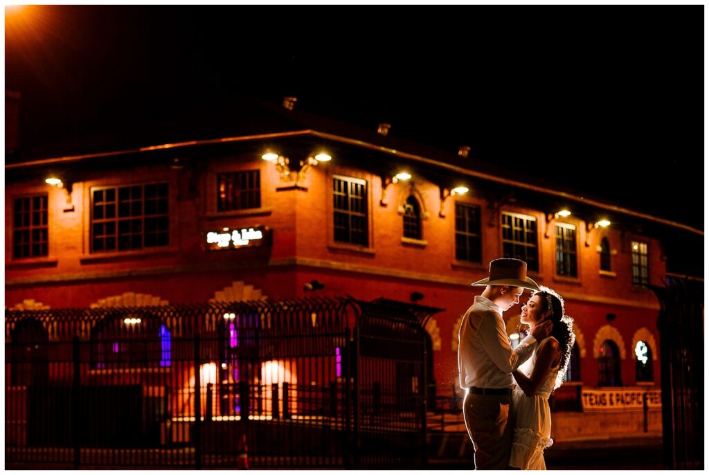 bride and grrom night portrait in front of the wedding venue saint rogers depot