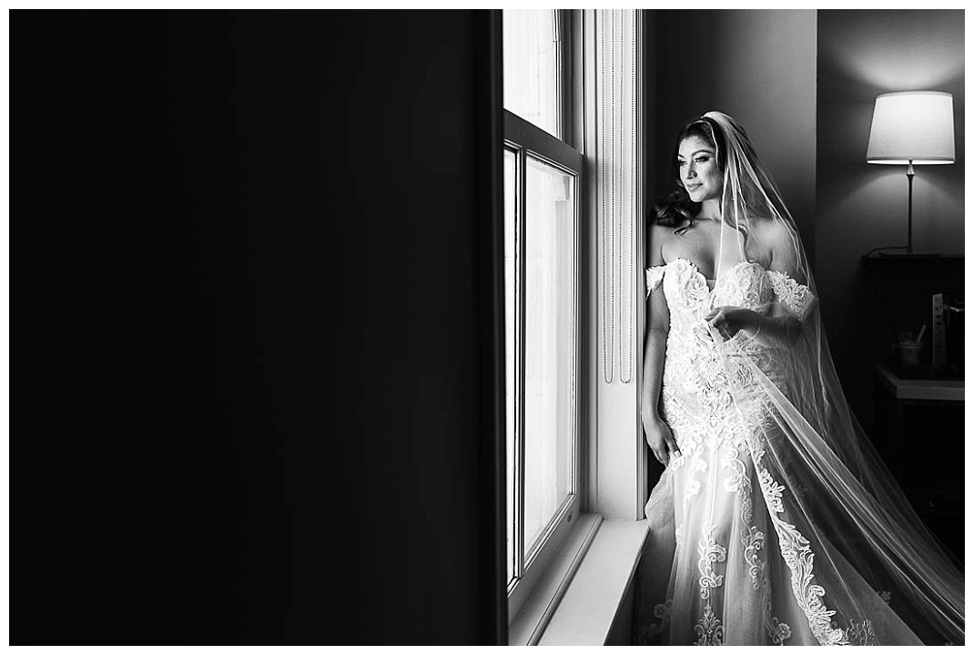 black and white portrait of Bride getting ready at Paso Del Norte Hotel in El Paso Texas