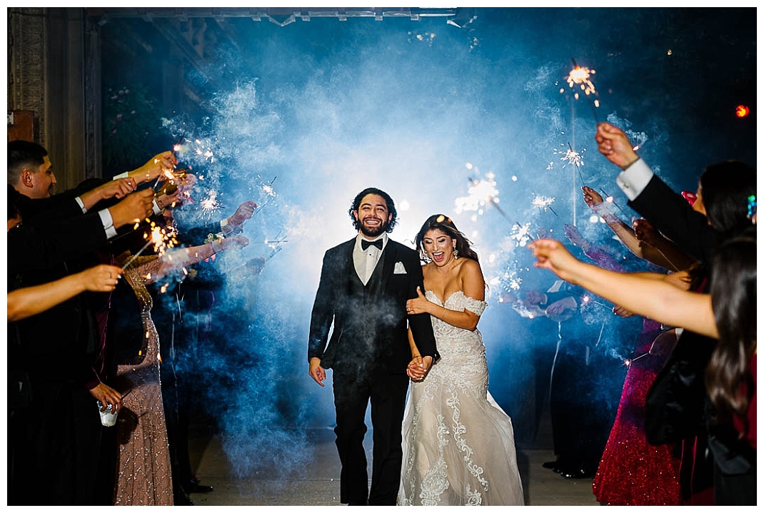Bride and groom exit at Cortez Ballrooms