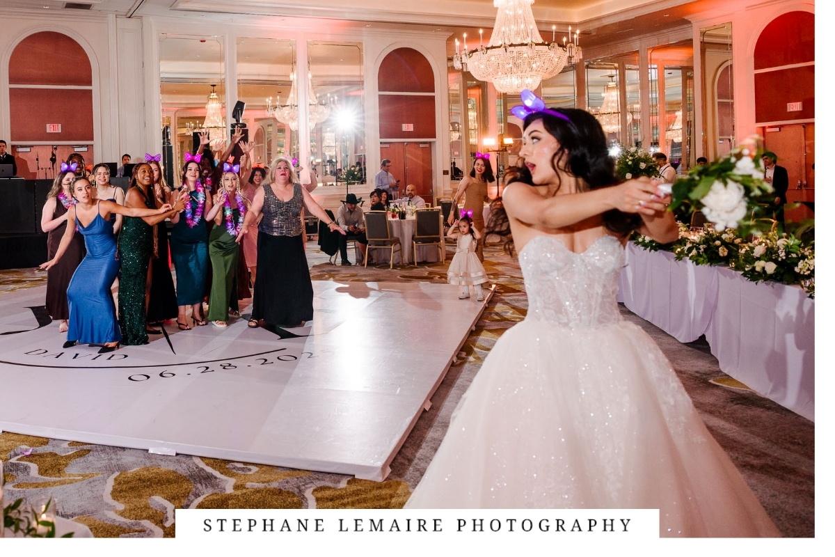 Bride tossing the bouquet at Hotel Paso del Norte