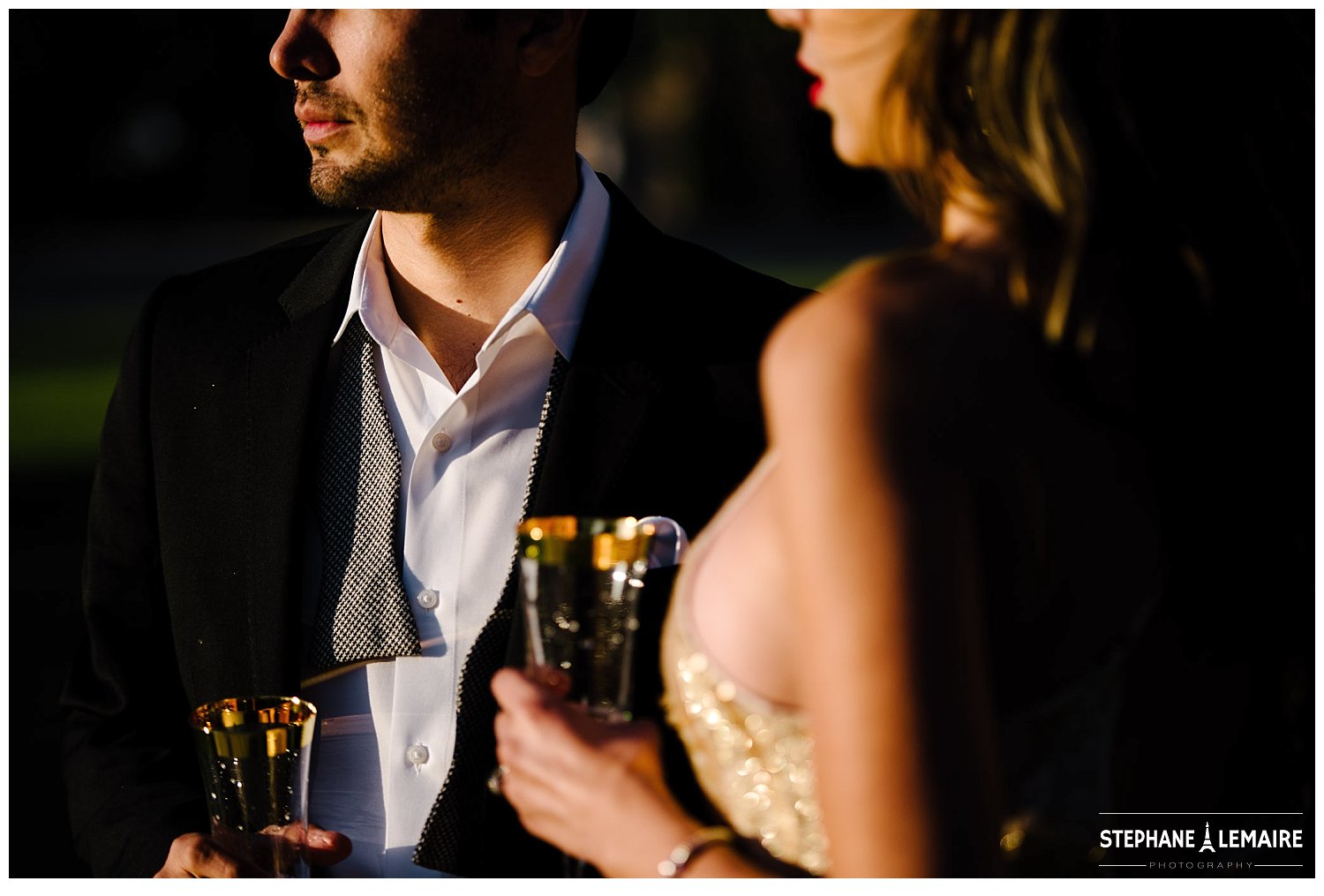 Details of couple in champagne dress and suit enjoying champagne in editorial style Marfa shoot 