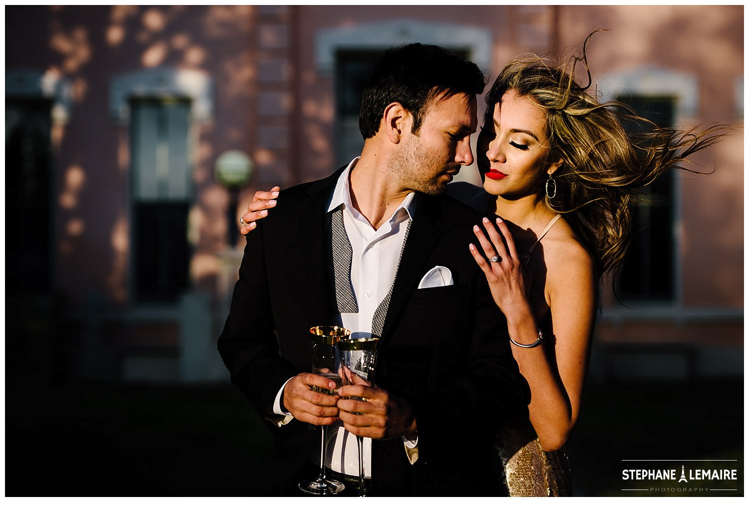 Couple in champagne dress and suit pops champagne in editorial style Marfa engagement session