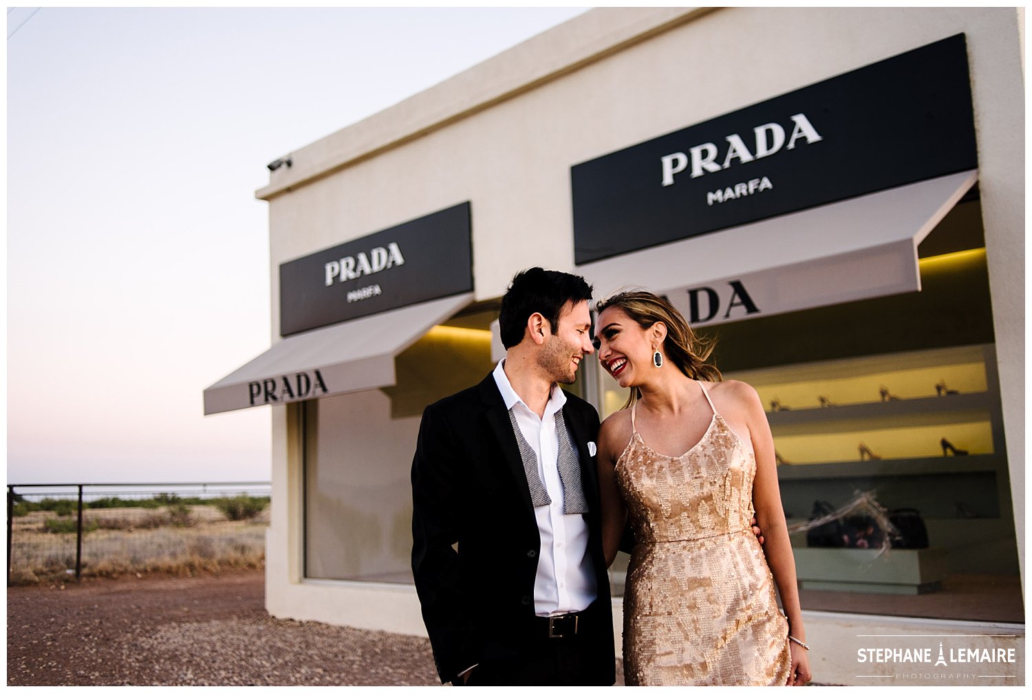 Couple in front of Marfa Prada storefront in editorial style engagement shoot by stephane lemaire photography 