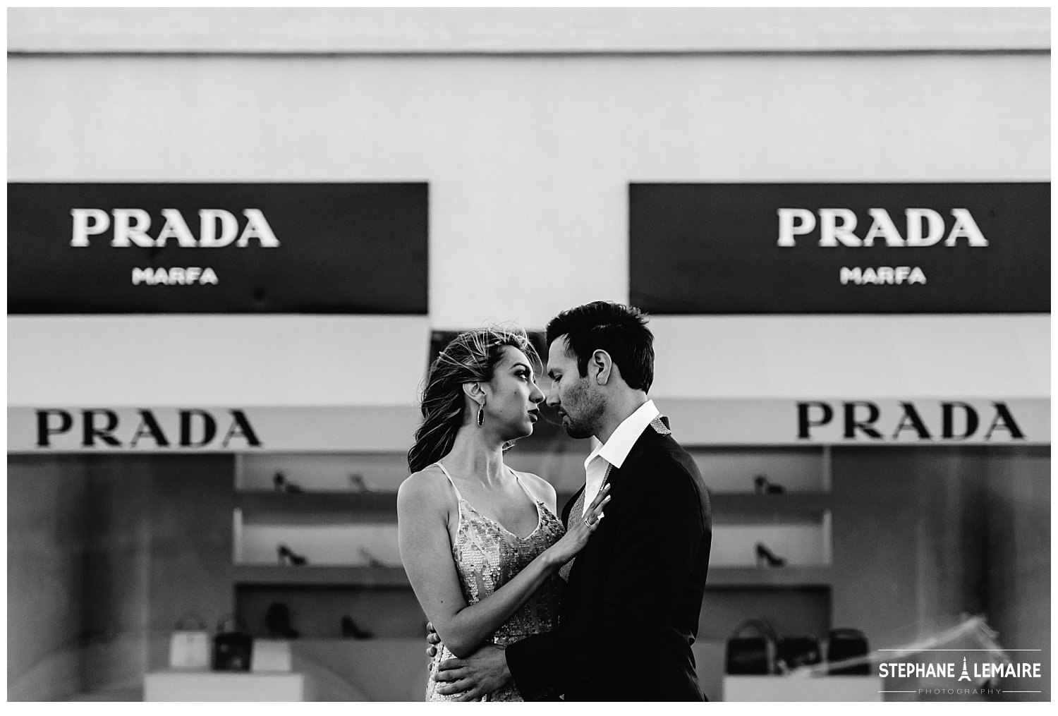 Couple in front of Marfa Prada storefront in editorial style engagement shoot