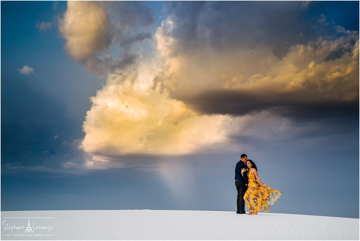 Couple hugging at White Sands National Monument by stephane Lemaire photography