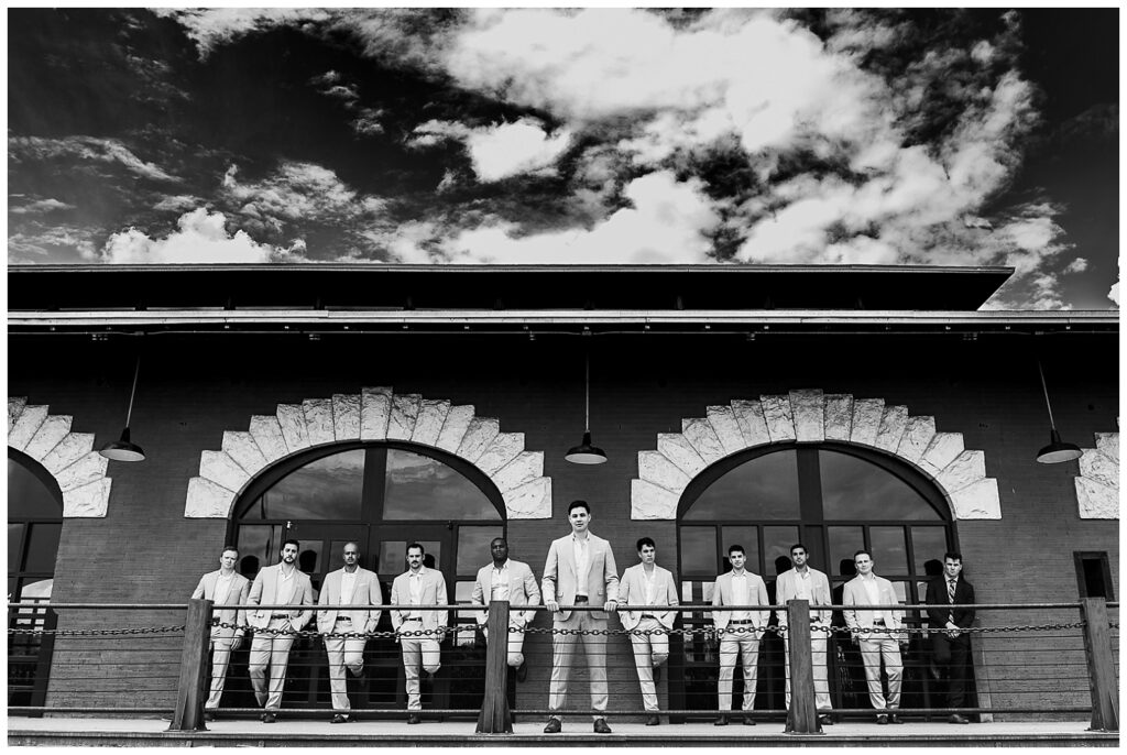Black and white photo of the groom and groomsmen at St Rogers Depot