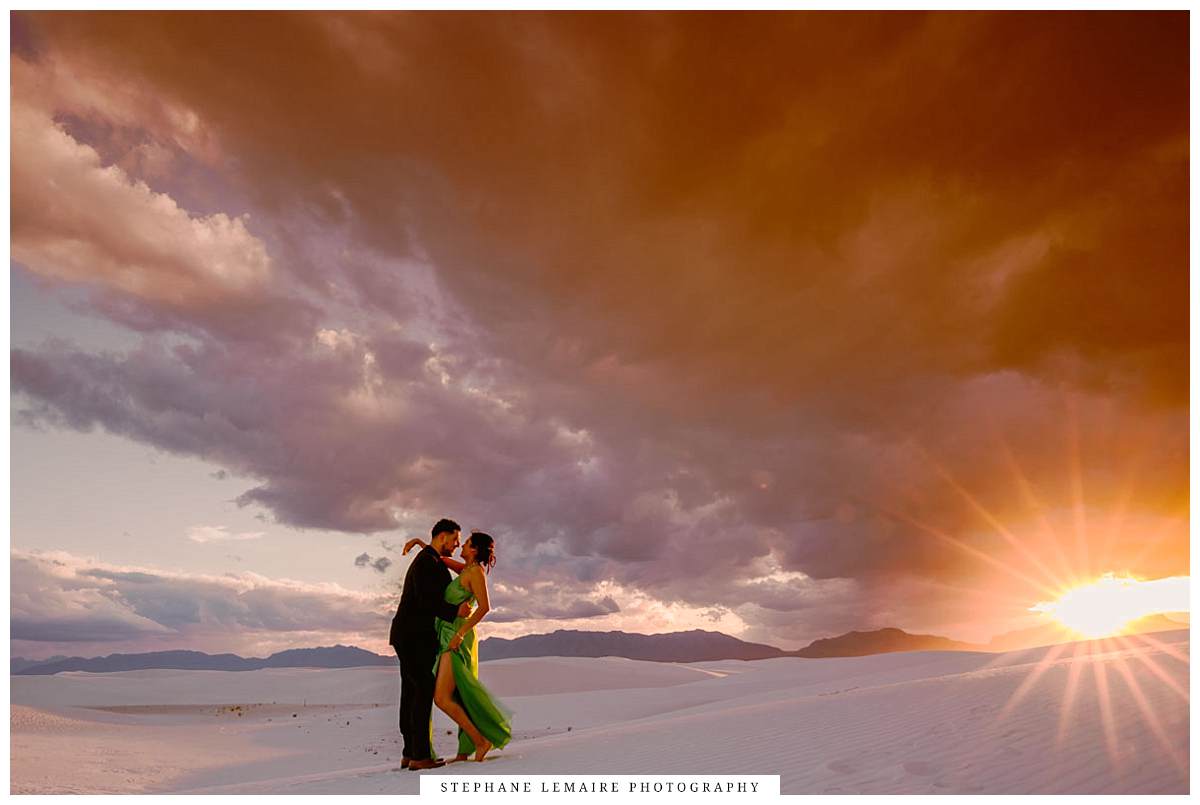 Couple walking through White Sands National Park at sunset
